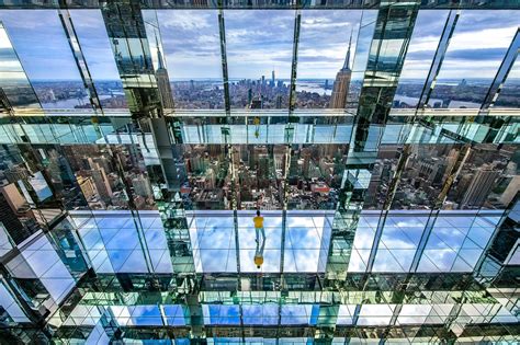 Summit one vanderbilt photos - A visitor poses for pictures during a preview of SUMMIT One Vanderbilt observation deck, which is spread across the top four floors of the new One Vanderbilt tower in Midtown Manhattan, New York ...